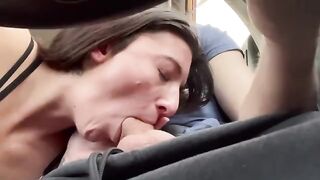 A couple gets a blowjob while driving on a real road trip