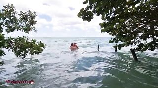 A couple enjoy sensual sex in the crystal clear waters of the blue lagoon