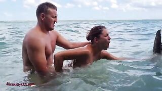 A couple enjoy sensual sex in the crystal clear waters of the blue lagoon