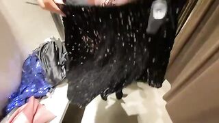Babe chooses a tight dress in the changing room and gets cum on her tits