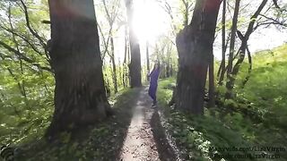 A woman receives cum in her mouth in a public place outdoors