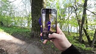 A woman receives cum in her mouth in a public place outdoors