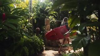A couple has sex on the beach in a passionate outdoor session