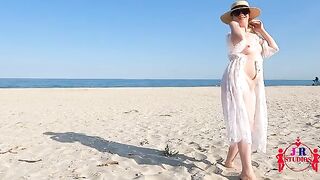 A blonde woman has sex on the public beach for the first time