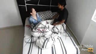 A young woman sneaks into the room of her friends