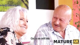 A mature woman seduces a guy while her husband is watching