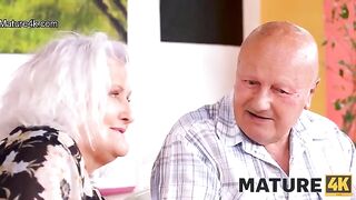 A mature woman seduces a guy while her husband is watching