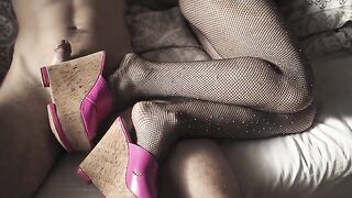 A sexy girl caresses her boyfriend’s cock through her pantyhose