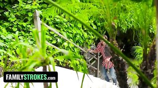 Two playful teens caught in a risqué 4th of July setup