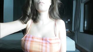 A pregnant girl plays with her big belly and boobs in a steamy show