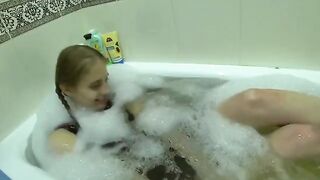A girl seduces her friend's wife in the kitchen