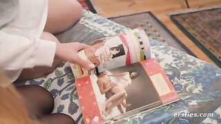 Two hot lesbians study the Kama Sutra before engaging in intimate acts