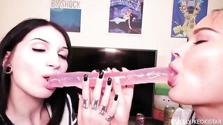 Two hot lesbian babes play with their nice juicy pussies using a dildo