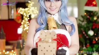 Sia Siberia is posing as a cute Christmas character and playfully engaging in solo activities