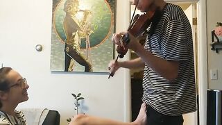 The couple was interrupted while trying to practice violin together