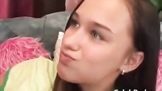 A young girl has sex with her adult guy friend on the couch
