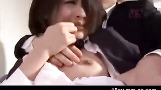 An Asian guy is painting the wall when his younger stepsister passes by