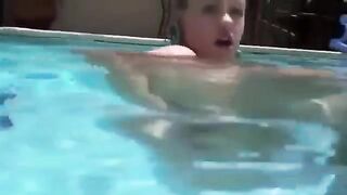 Babe plays with dildo in her ass under the water in the pool