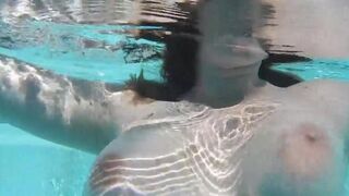 A naughty woman has sex with her dildo in the swimming pool