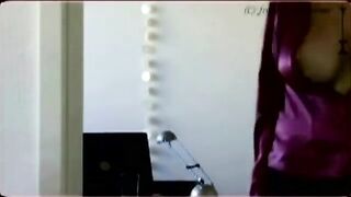 A peep show from behind the big tits of a porn star