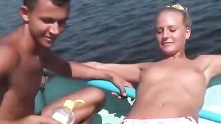 Sexual young people are having fun and playing around on the river