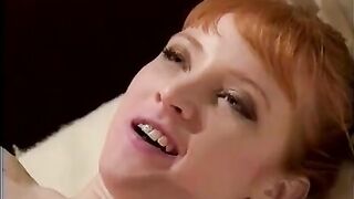 Two hot lesbian nurses in action with a big dildo, showcasing passionate strap-on play