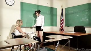 A girl is fucking with her teacher at her table