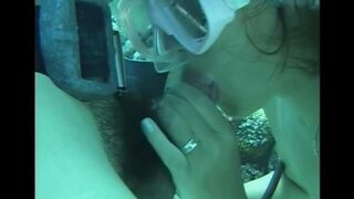 A guy has sex with a girl right in the water