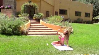 A blonde in sexy dress has sex on the lawn