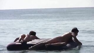 A young girl runs naked on the beach and shows her body