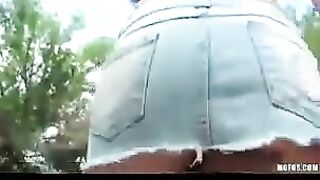 A hot brunette babe masturbates on the street for a camera