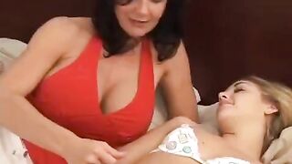 Young girl having fun with her older girlfriend using a strapon