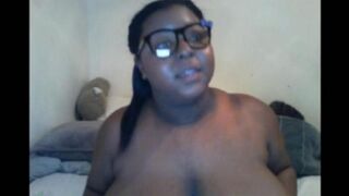 Black woman closed the camera with her big natural tits