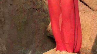A sexy girl is walking on the wet beach almost naked