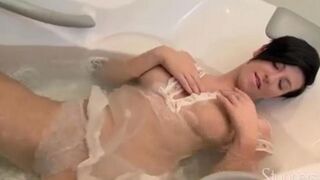 Lonely brunette woman caresses her pussy under the shower