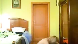 A pervert guy peeps on a hot babe in her room to fuck