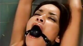 Girl was fucked by a bald man with a machine, showcasing intense BDSM