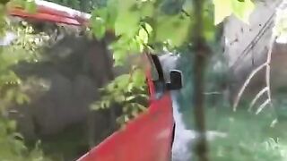 The guy squeezed tits of girl by a car and fucked her