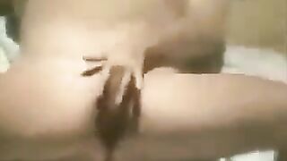 A girl was masturbating on the beach, not noticing a hidden camera
