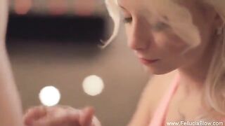 A sexy blonde is giving a blowjob in the studio