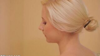 Girl masturbates with a toothbrush handle in the bathroom to achieve orgasm