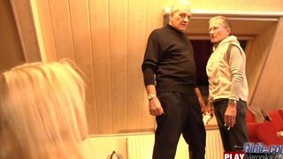 A gray-bearded man has sex with a young blonde with big tits