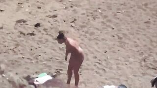 A naked couple enjoys each other on the sea