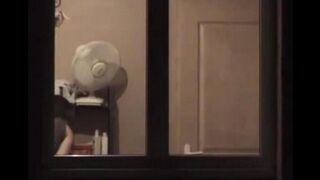 A hot guy admires his naked body in the mirror