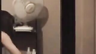 A hot guy admires his naked body in the mirror