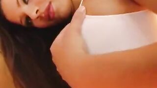 The girl plays with a dildo to make her wet vagina bigger