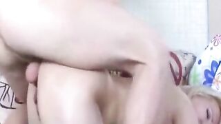 A woman in stockings fucks deep in her ass at home