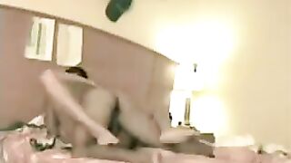 The couple fucked on the bed, spreading their legs