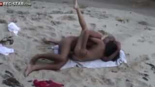 A couple has real sex on the beach with no one around