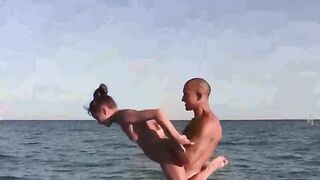 Acrobatic feats on the naked beach, a thrilling display of skill and exposure